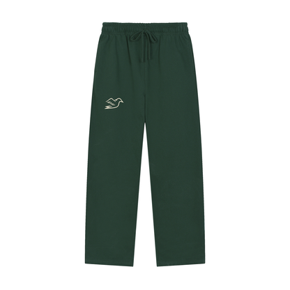 Blackish green heavyweight pants with Auspex bird at the hip, front view