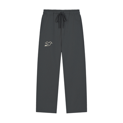 Dark gray heavyweight pants with Auspex bird at the hip, front view