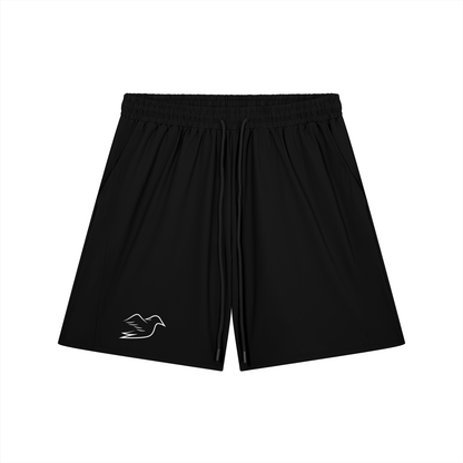 Black stretch shorts with Auspex bird on the leg, front view