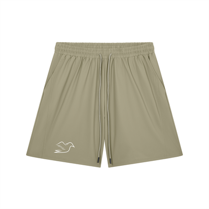 Khaki stretch shorts with Auspex bird on the leg, front view