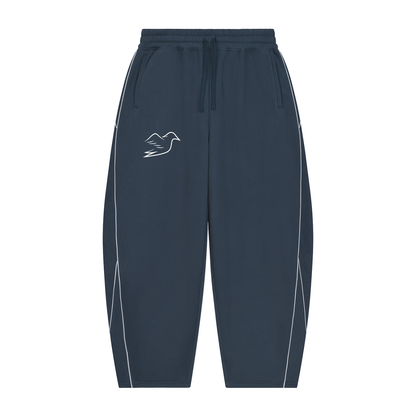Navy blue piping sweatpants with Auspex bird on the thigh, front view