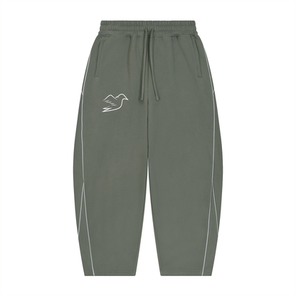 Medium gray piping sweatpants with Auspex bird on the thigh, front view