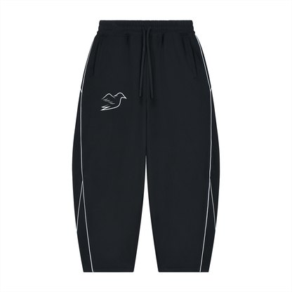 Black piping sweatpants with Auspex bird on the thigh, front view